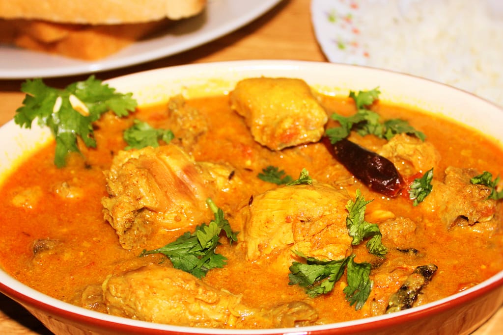 CHICKEN CURRY IN ALMOND GRAVY AND WHOLE SPICES